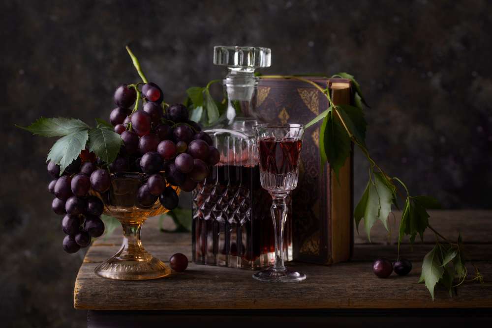 Wine Decanter and Grapes on a Table